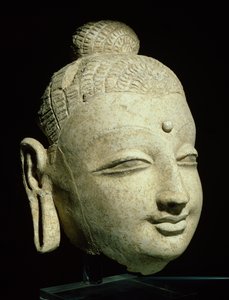 Hoofd van een glimlachende Boeddha, Grieks-Boeddhistische stijl, uit Afghanistan, 1e-4e eeuw