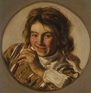 Lachende jongen met een fluit