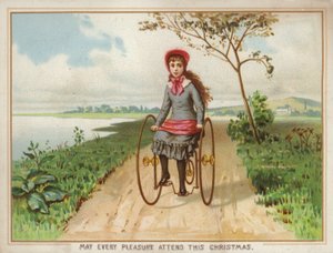 Meisje rijdt op een driewieler op het platteland door American School