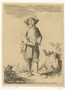 Staande man met stok in landschap