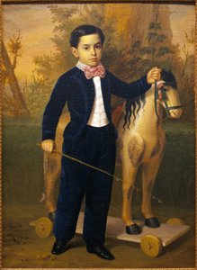 Portret van een jongetje met een houten paard