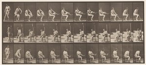 Plaat 418. Toilet, zittend en kousen aantrekken door Eadweard Muybridge