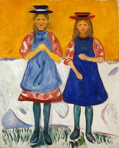 Twee kleine meisjes met blauwe schorten