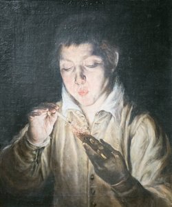 Jongen die een kooltje blaast