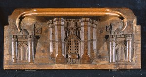 Een misericord die het paard van Sir Yvain toont, gevangen terwijl het valhek van een uitgebreide kasteelpoort wordt neergelaten, New College Chapel, Oxford, laat 14e eeuw (hout)