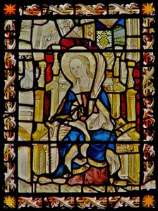 Het oostelijke raam met St. Faith die haar embleem de zaag draagt door English School