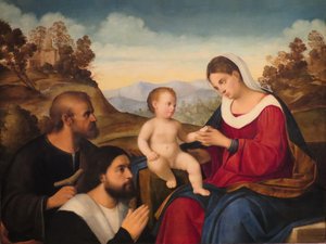 De Heilige Familie met een schenker in een landschap