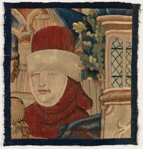 Klein wandtapijtfragment dat het hoofd van een man uitbeeldt, laat 15e eeuw