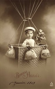 1913 Nieuwjaarskaart, met jongen die een ballon opstijgt, met veel geld als ballast