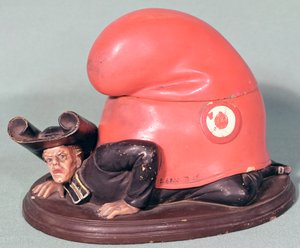 Een inktpot of tabakspot in de vorm van een priester verpletterd door een Frygische muts, 1870