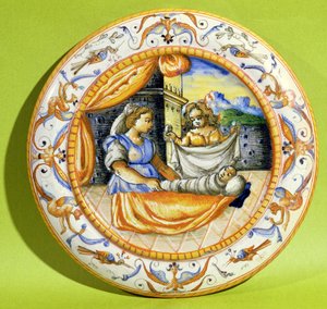 Geboorteplaat die de pasgeborene toont die in doeken wordt gewikkeld, uit Lyon (faience)