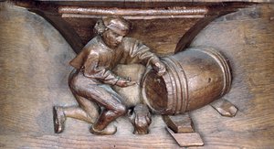 Houtsnijwerk van een man die een kraan op een vat zet, uit een koorbank van de Abdij van St. Lucien in Beauvais (hout)