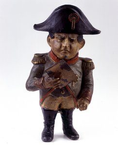 Beeldje gebruikt als spaarpot met de beeltenis van Napoleon I. Beeldje uit de tweede helft van de 19e eeuw. Collectie soldaten van weleer