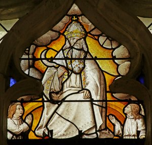 Raam met een scène uit het Boek Openbaring: God met sikkel