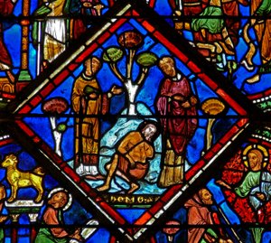 Raam w15 met een scène in het Barmhartige Samaritaan raam: de pelgrim wordt genegeerd door een priester en een Leviet door French School