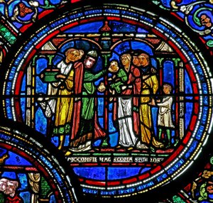 Raam w23 met St. Thomas Becket die kinderen bevestigt