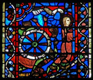 Raam w53 met afbeelding van een scène uit het leven van St. Catharina: de beulen bereiden het wiel voor haar beproeving voor door French School