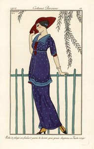 Vrouw in strandjurk van foulard versierd met grote stippen, rode suède hoed door Georges Barbier