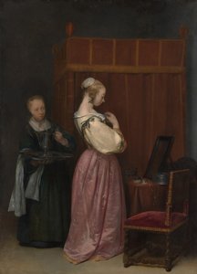 Een jonge vrouw bij haar toilet met een dienstmeid door Gerard Terborch II