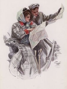 Man en vrouw lezen een kaart in een auto