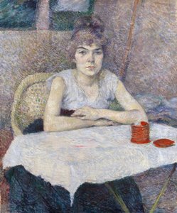 Jonge vrouw aan een tafel