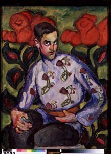 Portret van een jongen met een bloemenhemd.