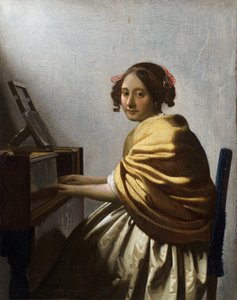 Jonge vrouw zittend aan een virginaal - Schilderij van Jan Vermeer (Johannes) (1632-1675) circa 1670