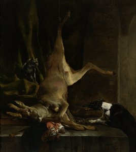 Een hond en een kat bij een gedeeltelijk opengereten hert
