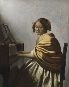 Een jonge vrouw zittend aan een virginaal, ca. 1670 door Jan Vermeer van Delft