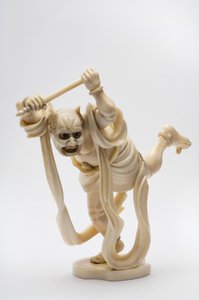 Okimono in de vorm van een demon met een stok door Japanese School