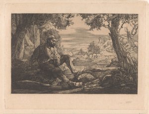 Zittende man in heuvellandschap