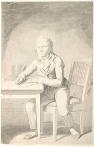 Jonge schrijvende jongen zittend aan een tafel