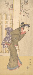 De vierde Iwai Hanshiro als een vrouw onder een torii
