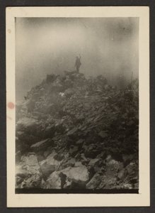 [Man Atop Rock Pile] door Louis Fleckenstein