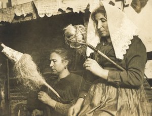Women spinning wool