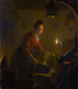 Vrouw in een keuken bij kaarslicht door Michiel Versteegh