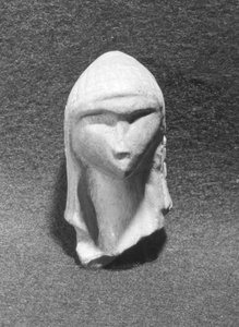 Hoofd van een vrouw bekend als Venus van Brassempouy, ca. 21000 v.Chr.