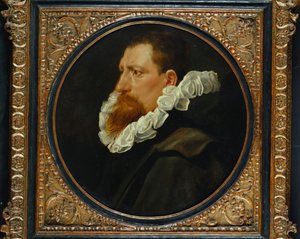 Portret van een heer, klein buste lengte, met een witte kraag en grijze mantel door Peter Paul Rubens