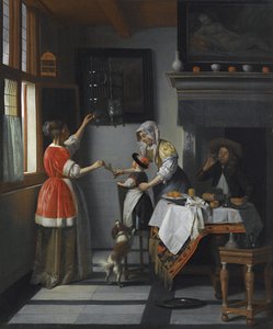 Interieur met een kind dat een papegaai voedt