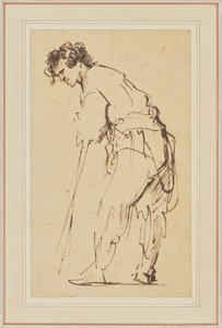 Jonge man leunend op een stok door Rembrandt Harmensz. van Rijn