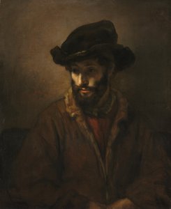 Een bebaarde man met een hoed door Rembrandt van Rijn