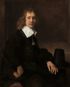 Een jonge man zittend aan een tafel mogelijk Govaert Flinck