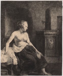 Een halfnaakte vrouw die bij de kachel zit door Rembrandt van Rijn