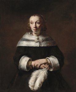 Portret van een vrouw met een struisvogelveren waaier door Rembrandt van Rijn