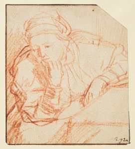 Saskia zittend aan een tafel door Rembrandt van Rijn