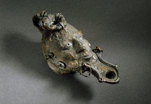 Romeinse kunst: bronzen olielamp in de vorm van een gezicht