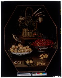 Een stilleven met granaatappels en druiven in een mand door Spanish School