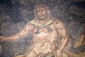 Polyphemus Hall. Detail van de cycloop die de ingewanden van een geit verslindt. Romeinse Villa van de Casale, Sicilië. UNESCO-site.
