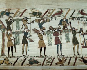 Wapens en wijn worden naar de schepen gebracht tijdens de bevoorrading voor de verovering van Engeland door de vloot van Willem de Veroveraar in 1066. Detail van het tapijt van Bayeux door Unknown artist