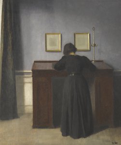 Ida staand aan een bureau door Vilhelm Hammershøi